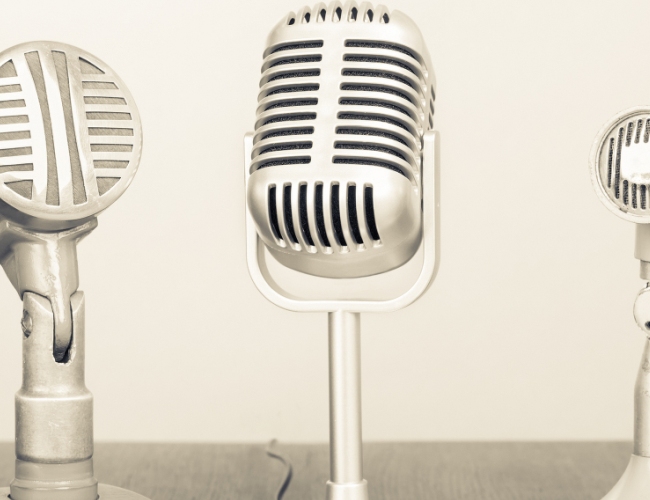 Close up of three silver microphones